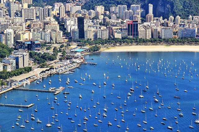 Buildings, bright sky and a lot of boats in the sea